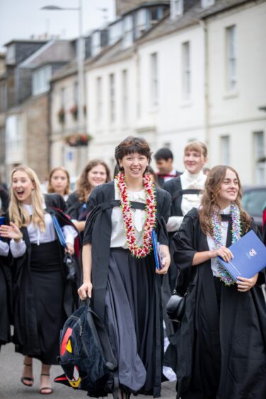Graduates make their way to St Salvator's Quad after the ceremony at St Andrews University graduation.
