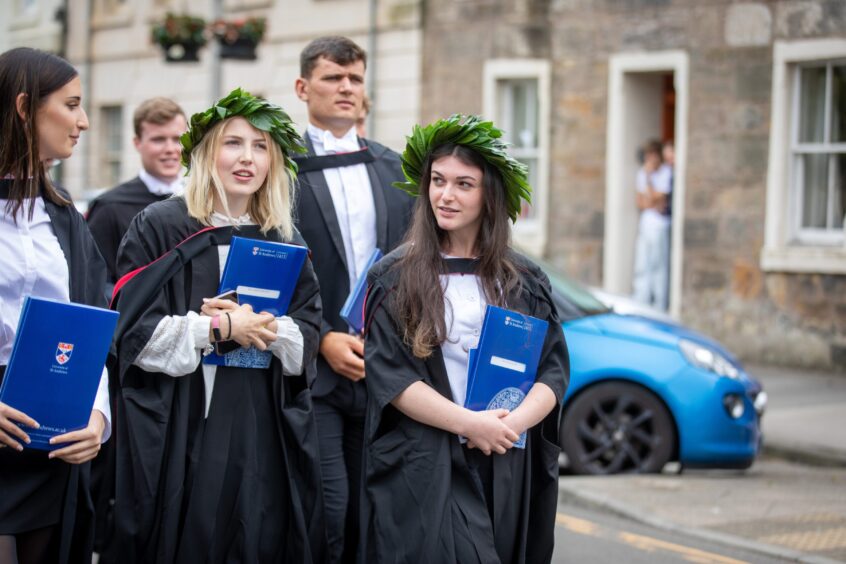 Graduates make their way to St Salvator's Quad after the ceremony at St Andrews University graduation.