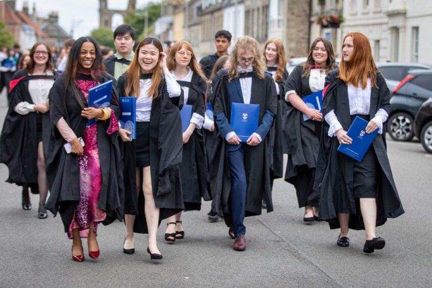 Graduates make their way to St Salvator's Quad after the ceremony at St Andrews University graduation.