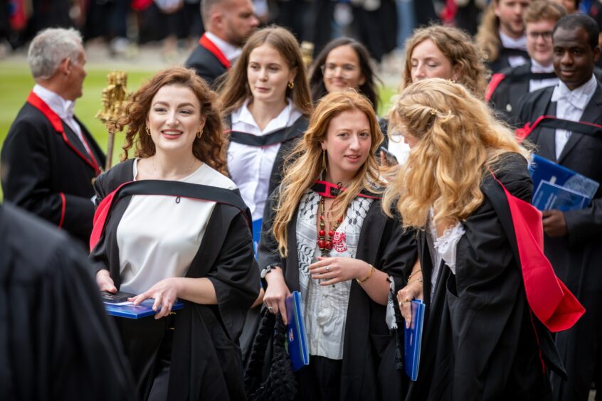 Graduates make their way to St Salvator's Quad after the ceremony at St Andrews University graduation.