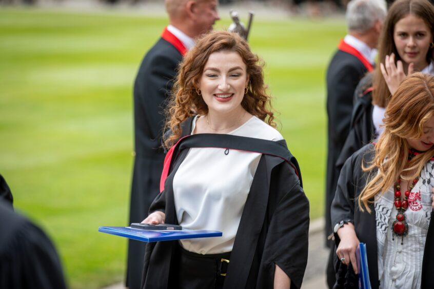 Graduates make their way to St Salvator's Quad after the ceremony at St Andrews University graduation.