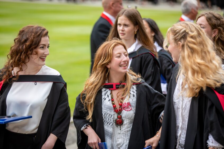 Graduates make their way to St Salvator's Quad after the ceremony at St Andrews University graduation.