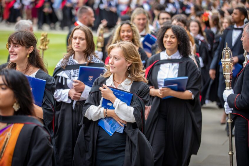 Graduates make their way to St Salvator's Quad after the ceremony at St Andrews University graduation.