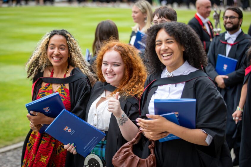 Graduates make their way to St Salvator's Quad after the ceremony at St Andrews University graduation.