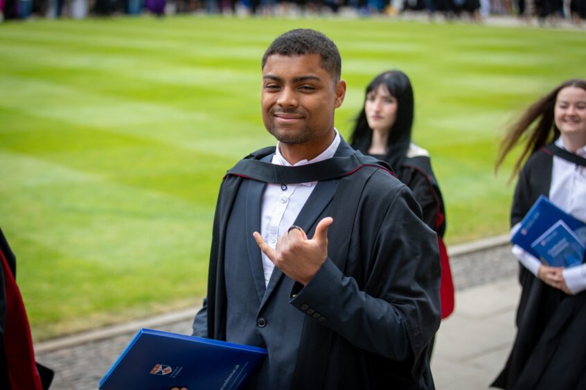 Graduates make their way to St Salvator's Quad after the ceremony at St Andrews University graduation.