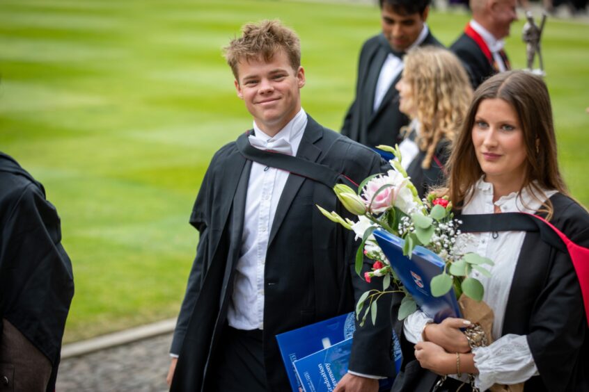 Graduates make their way to St Salvator's Quad after the ceremony at St Andrews University graduation.