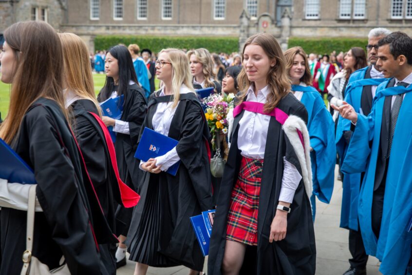 Graduates make their way to St Salvator's Quad after the ceremony at St Andrews University graduation.