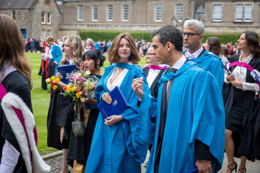 Graduates make their way to St Salvator's Quad after the ceremony at St Andrews University graduation.