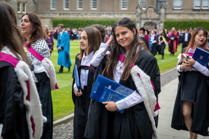Graduates make their way to St Salvator's Quad after the ceremony at St Andrews University graduation.