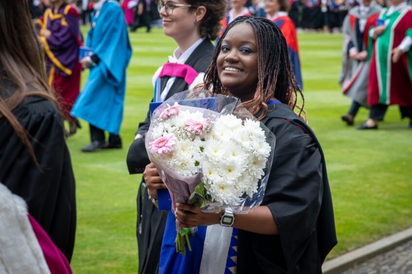 Graduates make their way to St Salvator's Quad after the ceremony at St Andrews University graduation.