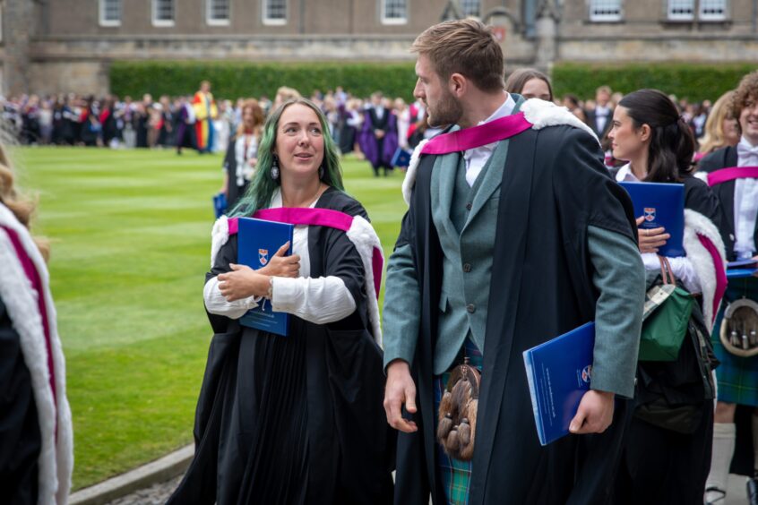 Graduates make their way to St Salvator's Quad after the ceremony at St Andrews University graduation.
