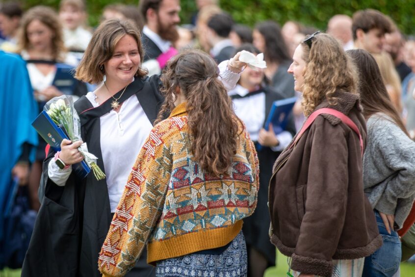 Graduates make their way to St Salvator's Quad after the ceremony at St Andrews University graduation.