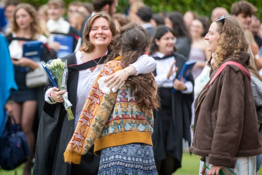 Hugs for a graduate.