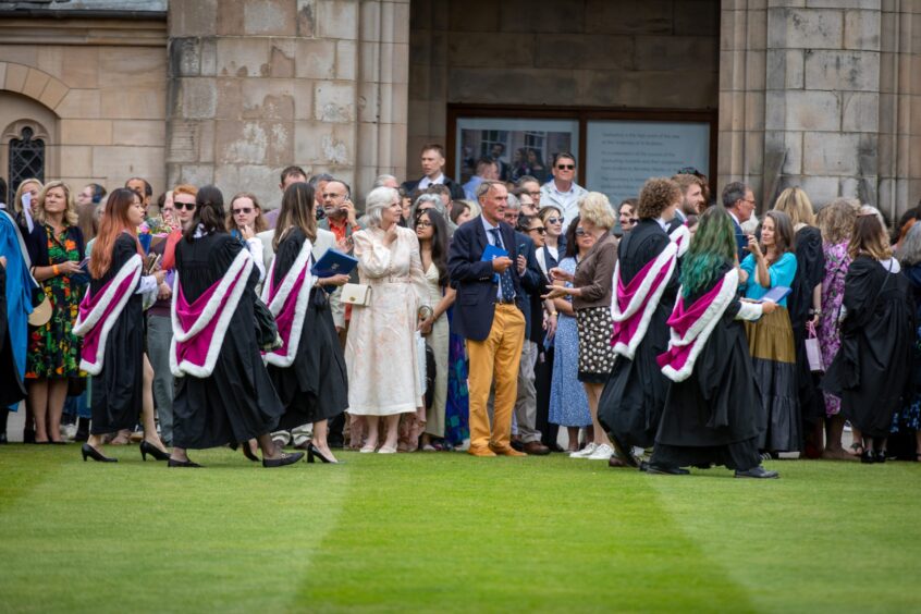 Graduates make their way to St Salvator's Quad after the ceremony at St Andrews University graduation.