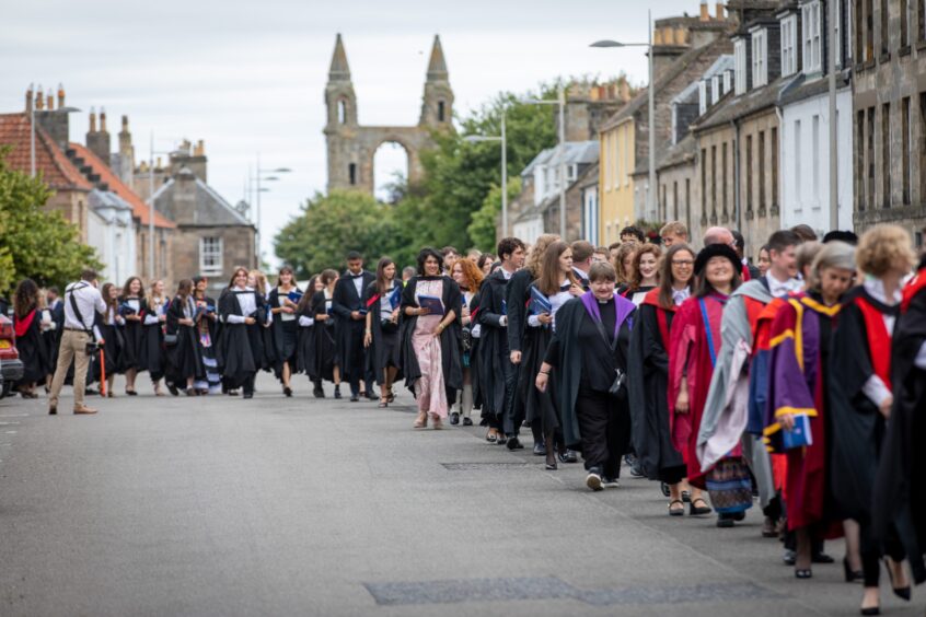 Graduates make their way to St Salvator's Quad after the ceremony at St Andrews University graduation.