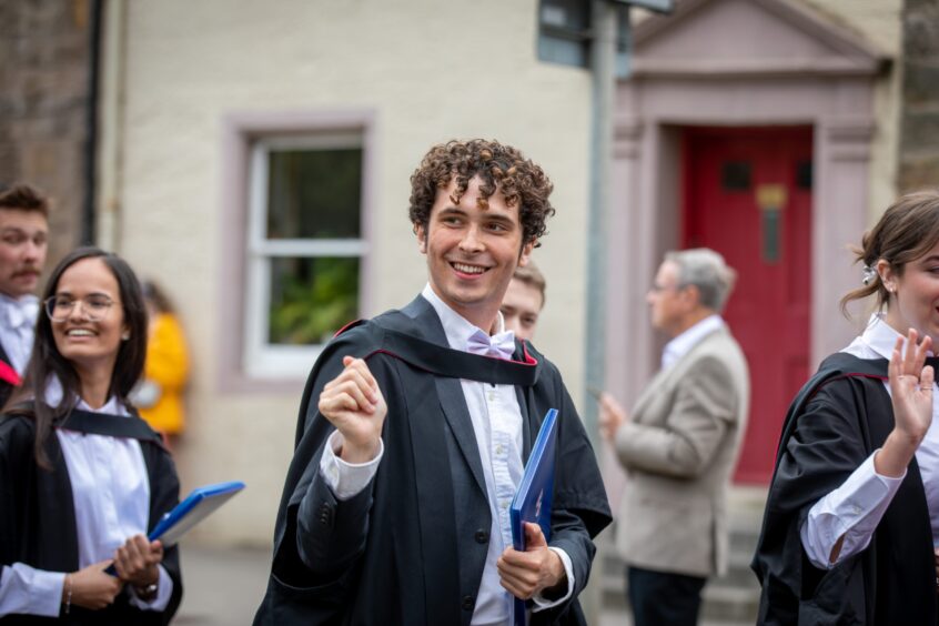 Graduates make their way to St Salvator's Quad after the ceremony at St Andrews University graduation.