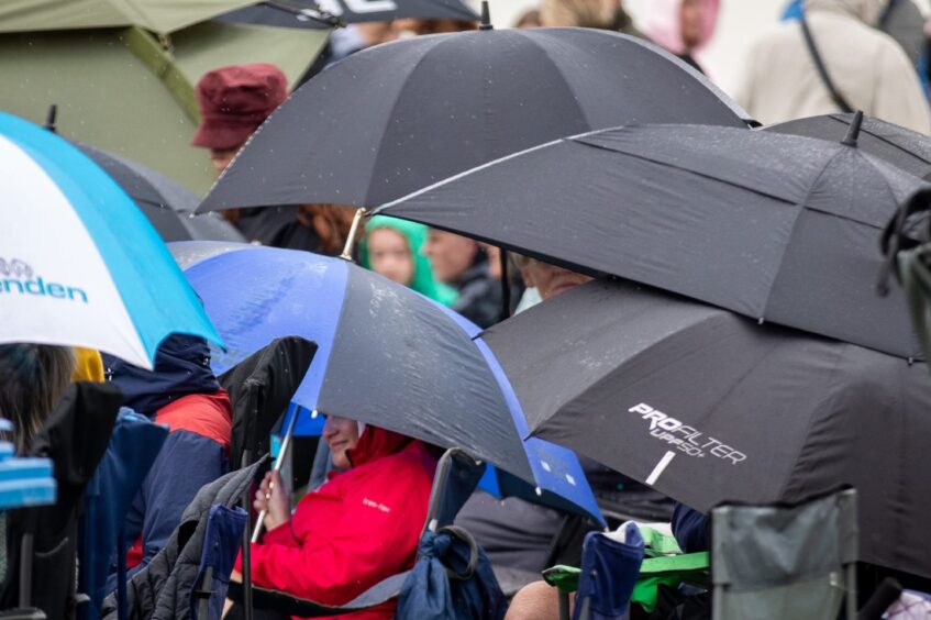 Umbrellas on show during the rain at St Andrews Highland Games.