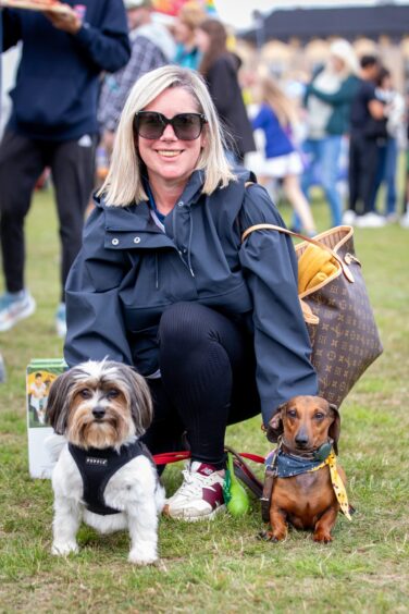 A local woman with her two dogs at St Andrews Highland Games.