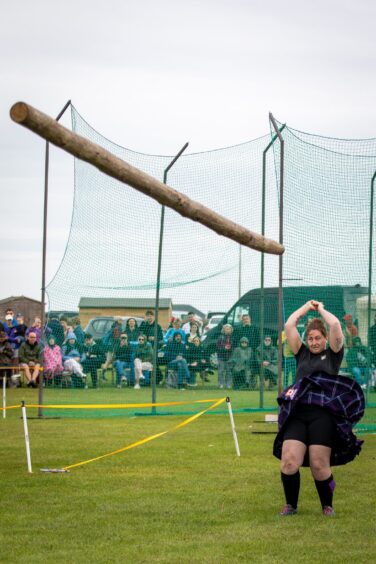A caber takes flight at St Andrews Highland Games.