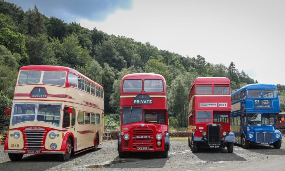 Four colourful vintage buses at the Vintage Bus Museum.