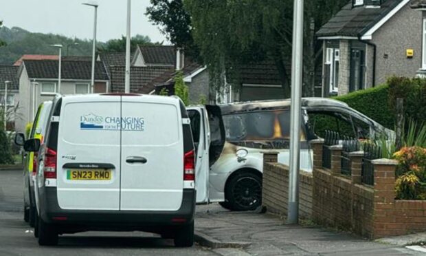 Burnt-out vehicle in Kettins Terrace, Strathmartine, Dundee.