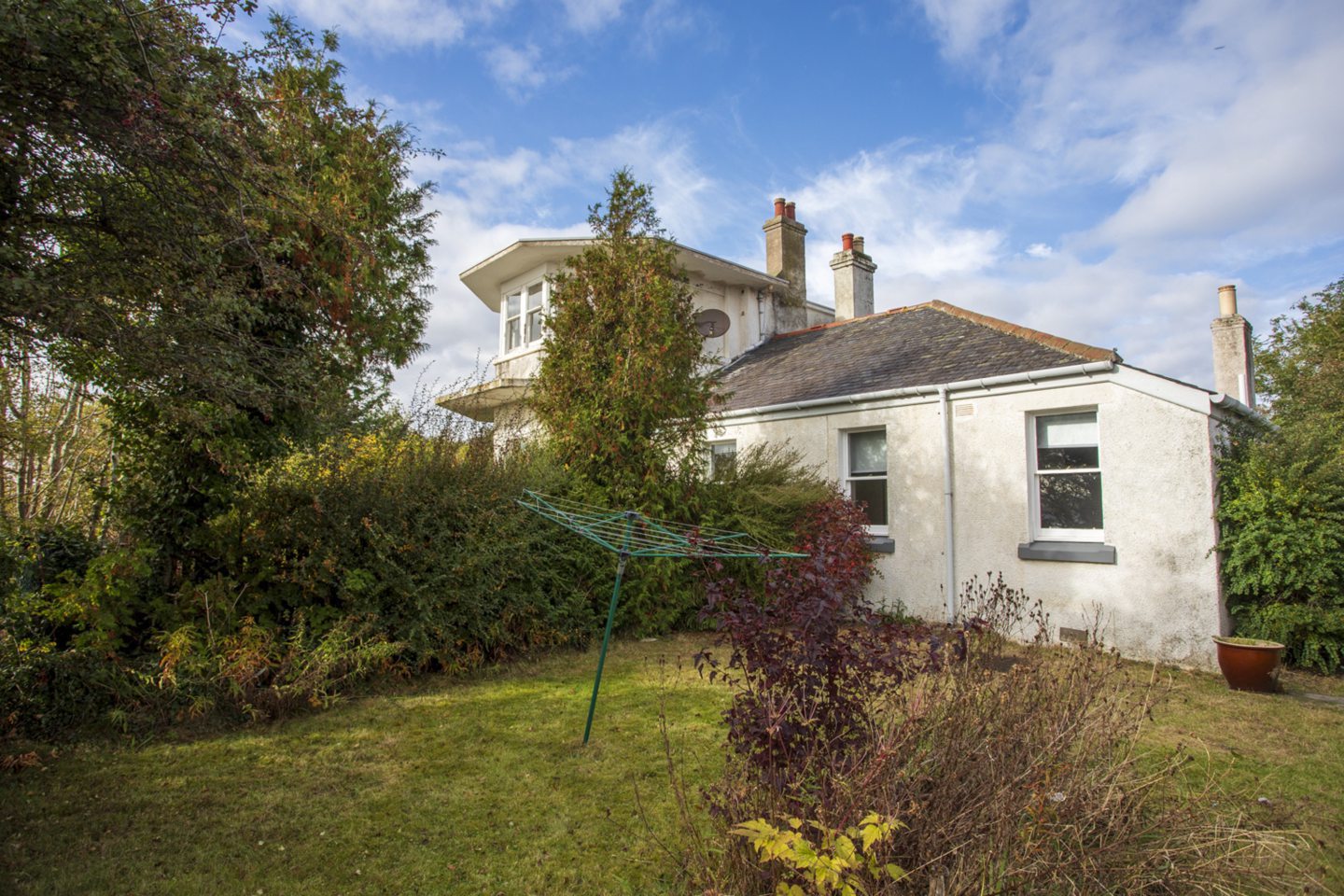 The station and cottage are surrounded by an enclosed garden.