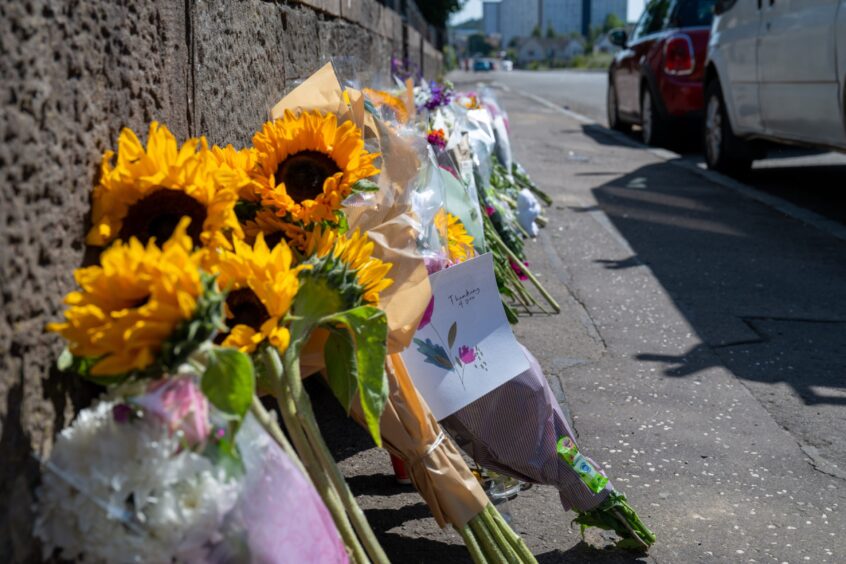 Floral tributes were left on South Road.