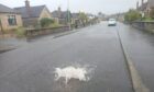 Heavy rainfall has blocked drains on Stuart Avenue in Perth. Image: Sean O'Neil/DC Thomson
