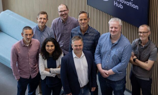 Dr Andrew Woodland (front row, centre) with the Tay/Hawkhill Therapeutics team. Image: Supplied.