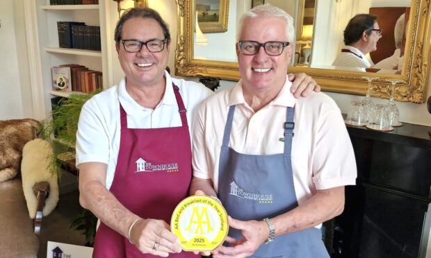 Laurent Moller and David Henderson, co-owners of The Townhouse, holding AA award and smiling broadly