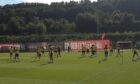 Dundee United players are put through their paces.