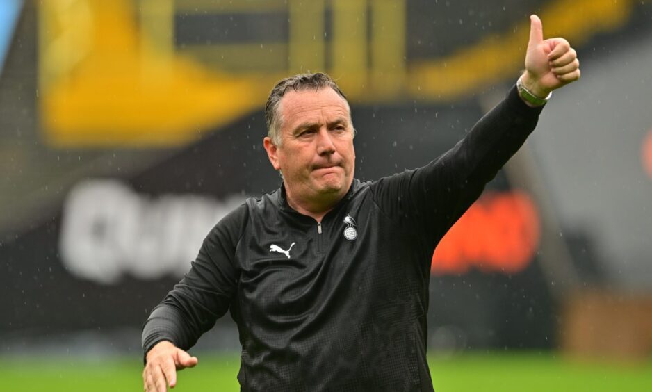 Micky Mellon salutes the United faithful
