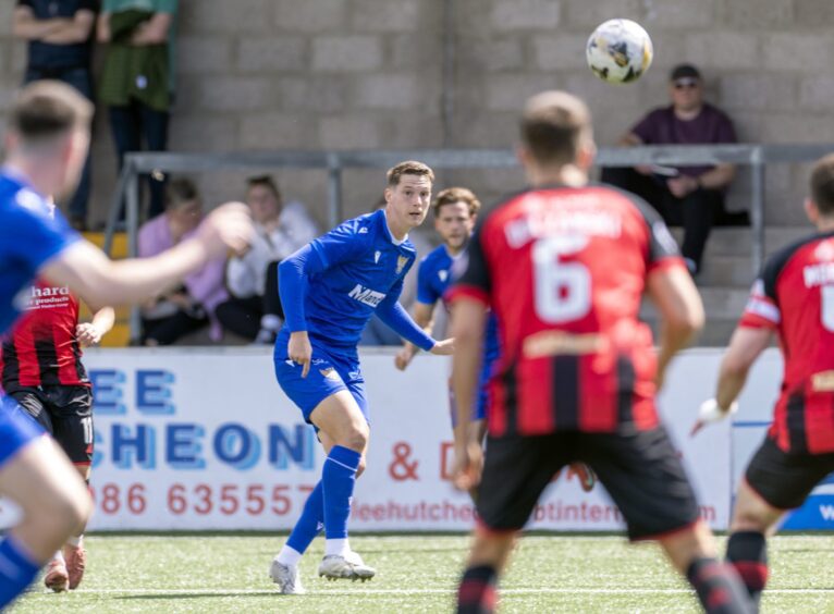 Matty Foulds crosses the ball.