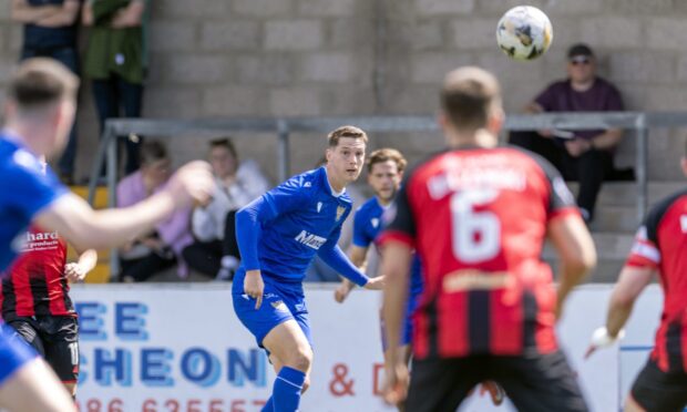 Matty Foulds crosses the ball.