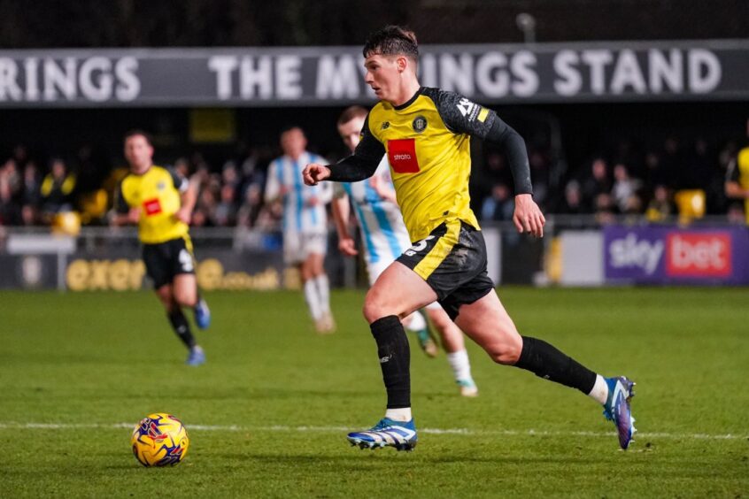 Matty Foulds strides out of defence.