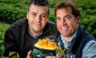 Geoff Bruce, of Bruce Farms, right, with Scotty Brand development manager Andrew Young