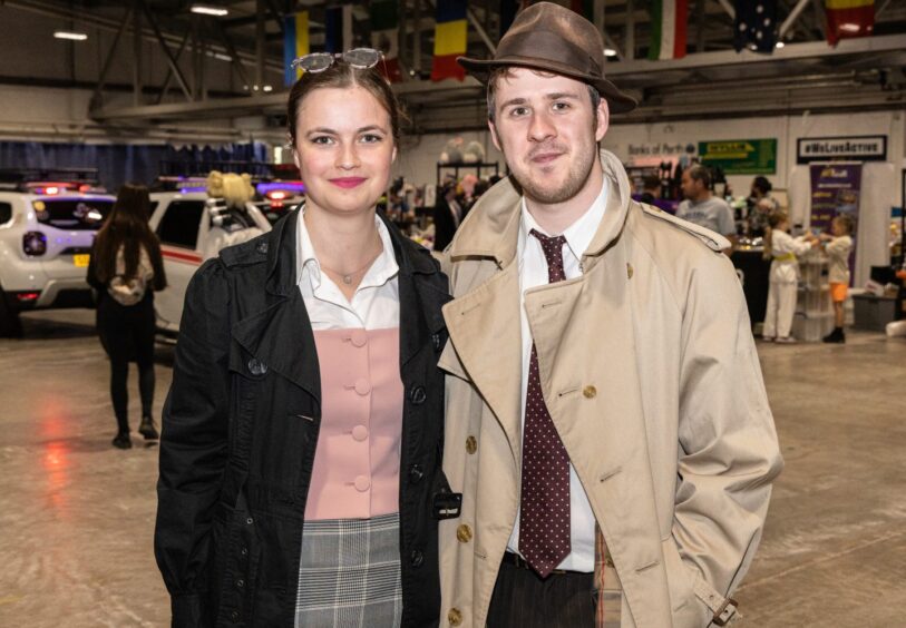 A young couple enjoy the atmosphere at Perth Comic Con 2025.
