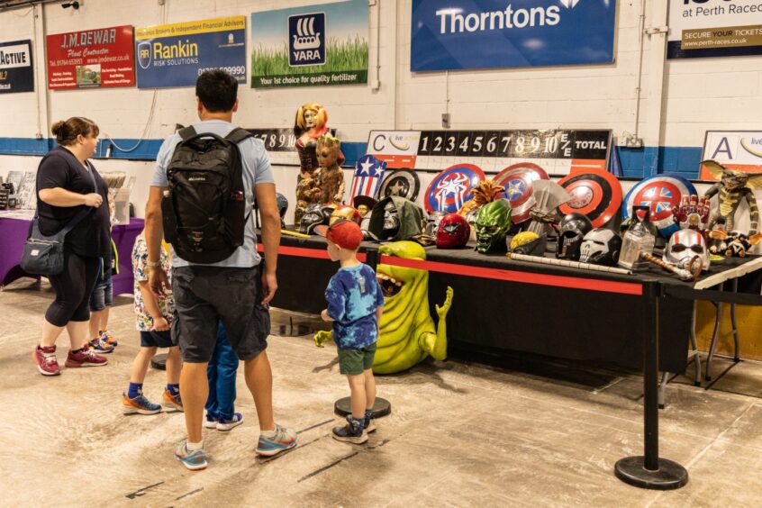 A merchandise display at Perth Comic Con 2025.