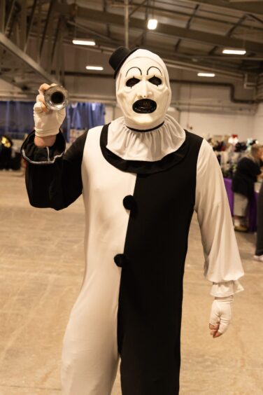 A visitor to Perth Comic Con 2025 dressed as horror icon Art the Clown.