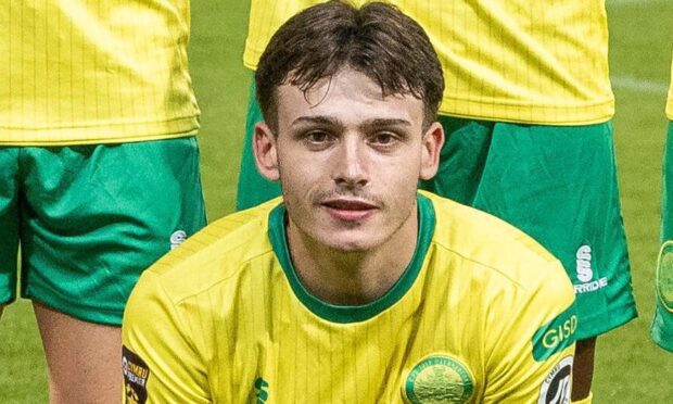 Louis Lloyd in Caernarfon Town's team photo before a European game.