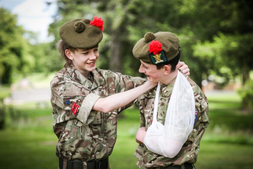 Two children dressing up as Black Watch soldiers at a WW2 reenactment day, Perth.