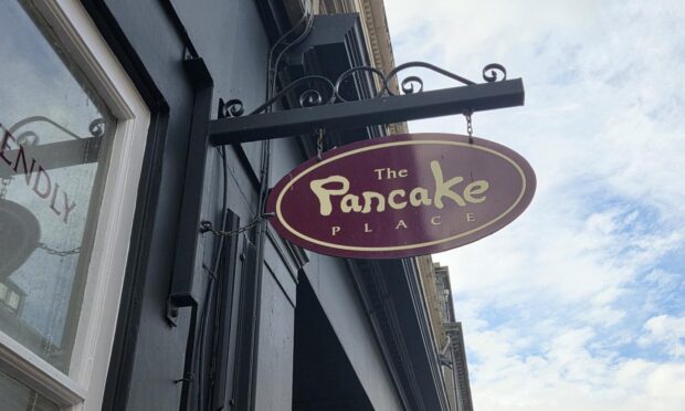 Pancake Place sign hanging outside Dundee cafe