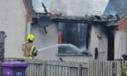 A fire fighter fighting the blaze. Image: Supplied