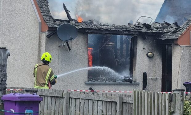 A fire fighter fighting the blaze. Image: Supplied