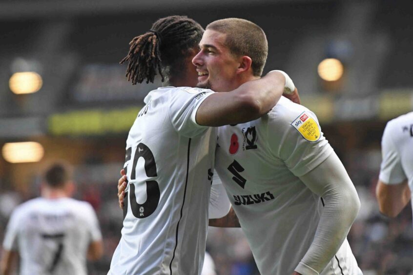 Watters celebrates finding the net for MK Dons. 