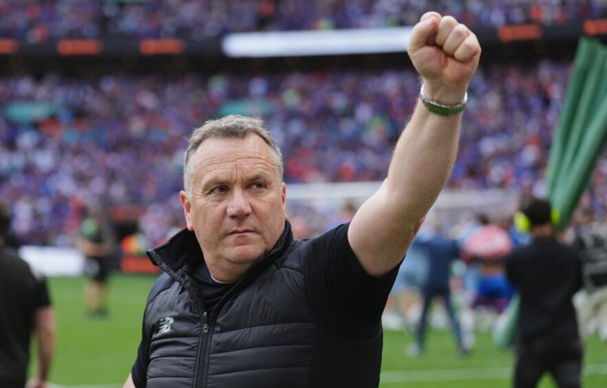 Micky Mellon celebrates Oldham's National League playoff final triumph last season