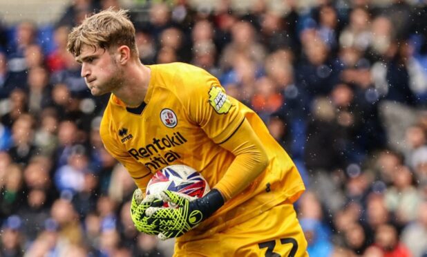 Toby Steward gathers the ball playing for Crawley Town.
