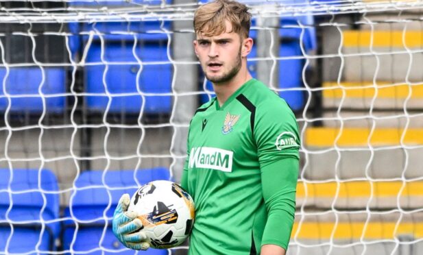 Toby Steward clutches the ball.