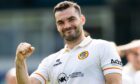 Tony Watt clenches his fist after Partick Thistle beat Ross County.