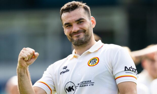 Tony Watt clenches his fist after Partick Thistle beat Ross County.